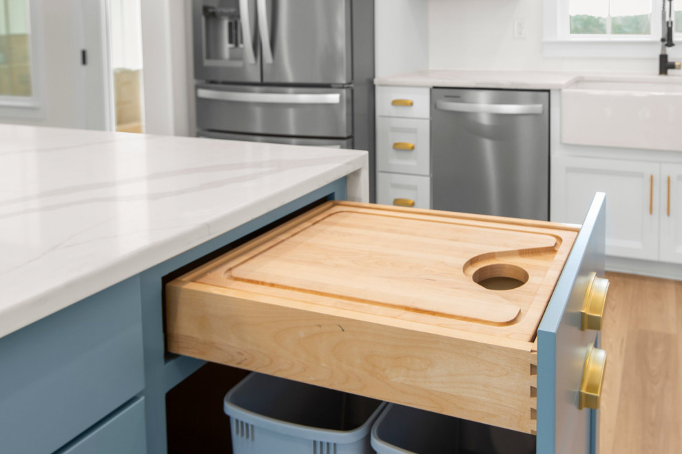 Large transitional l-shaped open concept kitchen photo in Richmond with a farmhouse sink, recessed-panel cabinets, quartz countertops, white backsplash, stainless steel appliances, an island and white countertops