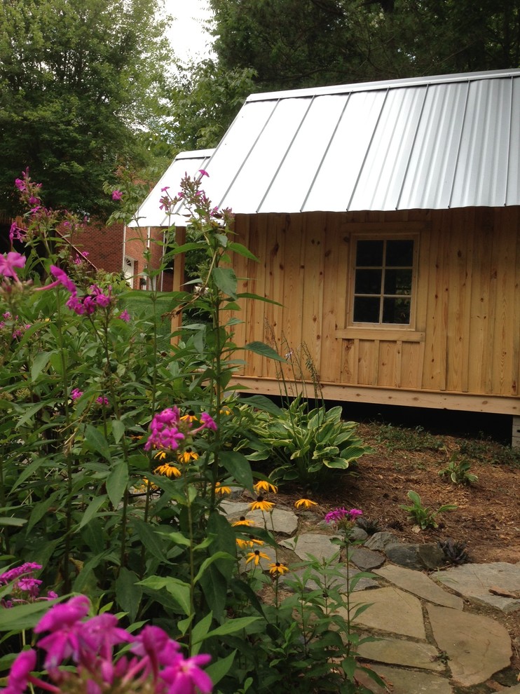 This is an example of a mid-sized traditional detached garden shed in Charlotte.