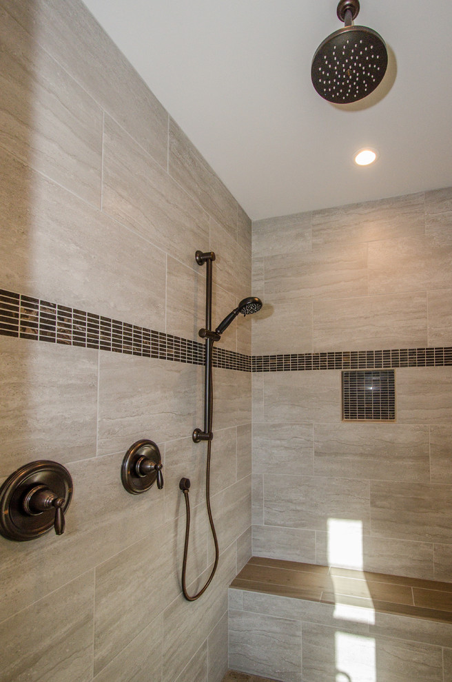 Country master bathroom in DC Metro with brown tile, grey walls and porcelain tile.