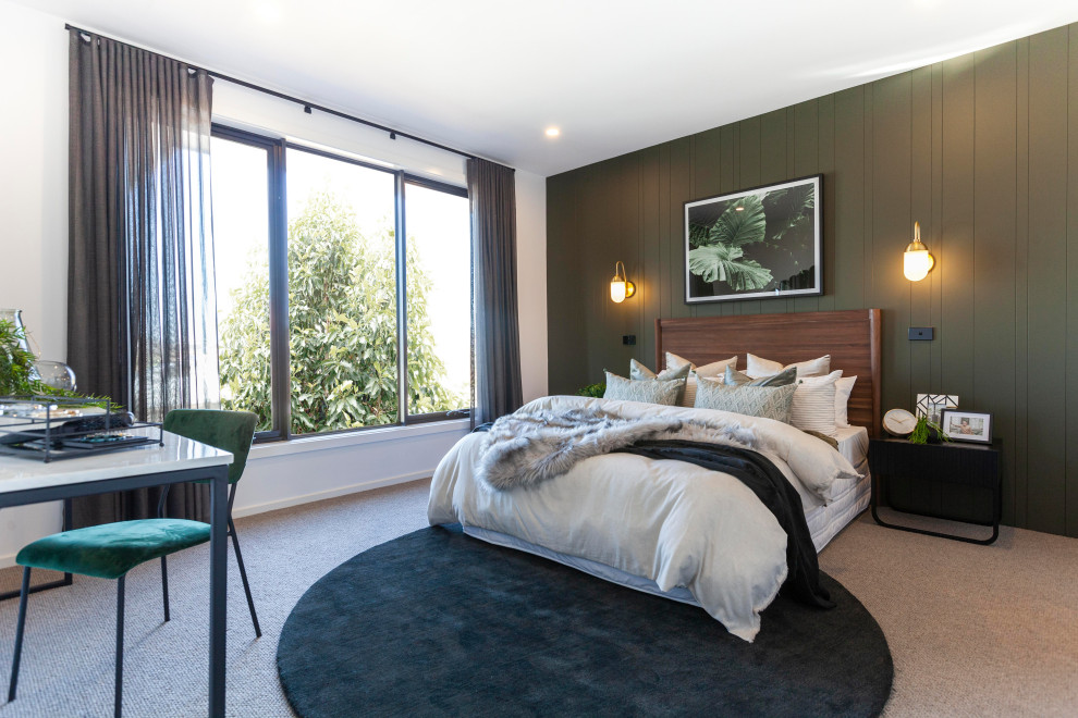 Design ideas for a large contemporary bedroom in Melbourne with green walls, carpet, beige floor and panelled walls.
