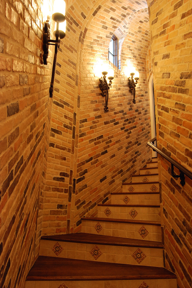 Inspiration for a large rustic brick floor wine cellar remodel in Austin with display racks