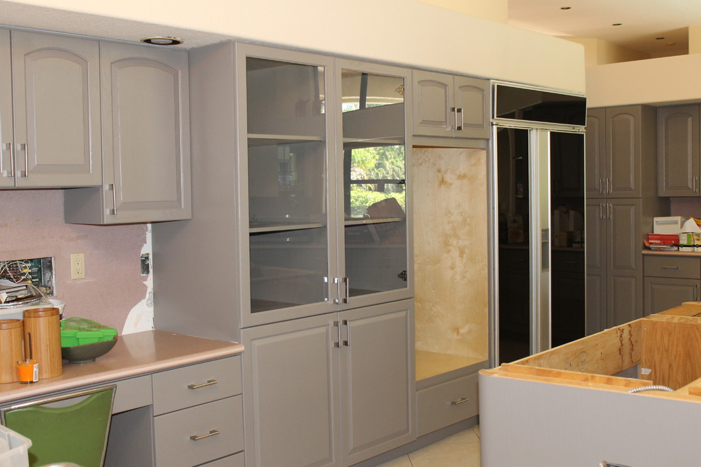 Design ideas for a large contemporary galley open plan kitchen in Miami with raised-panel cabinets, grey cabinets and with island.