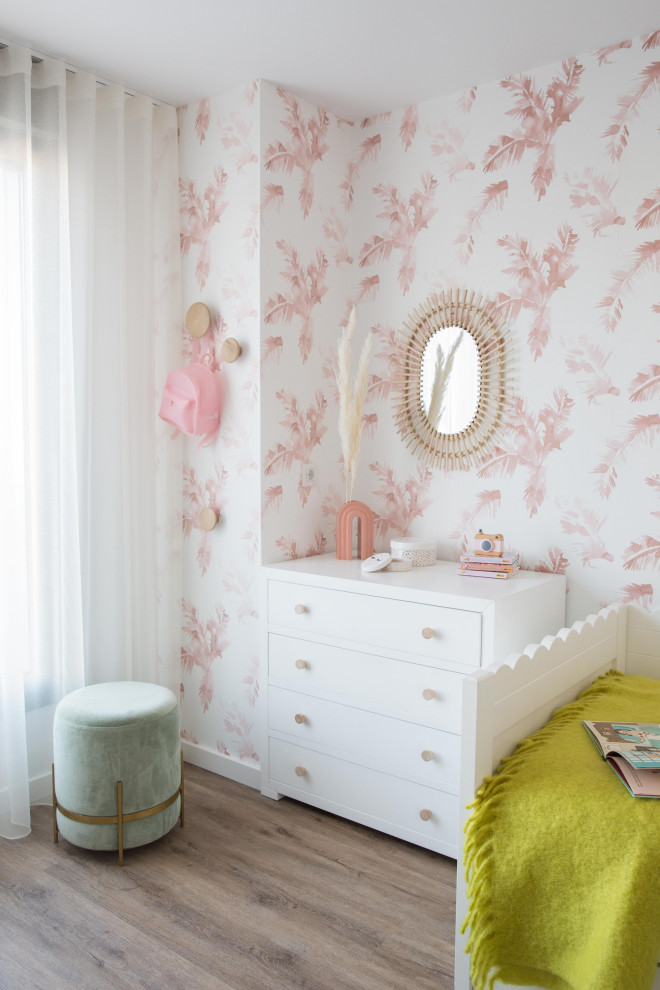 This is an example of a large scandinavian kids' bedroom for kids 4-10 years old and girls in Other with pink walls, dark hardwood floors and brown floor.
