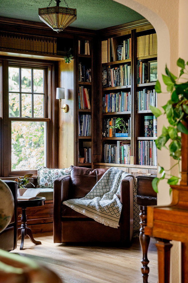 Transitional medium tone wood floor and brown floor home office photo in Other with beige walls