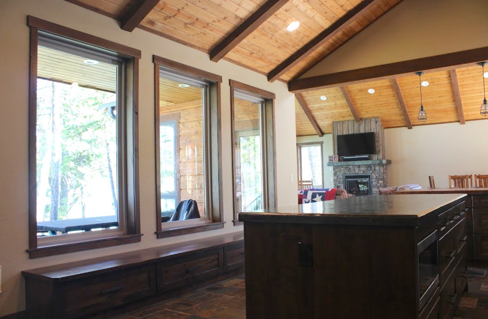 Inspiration for a mid-sized transitional l-shaped medium tone wood floor and multicolored floor eat-in kitchen remodel with an undermount sink, shaker cabinets, light wood cabinets, granite countertops, beige backsplash, stone tile backsplash, stainless steel appliances and an island