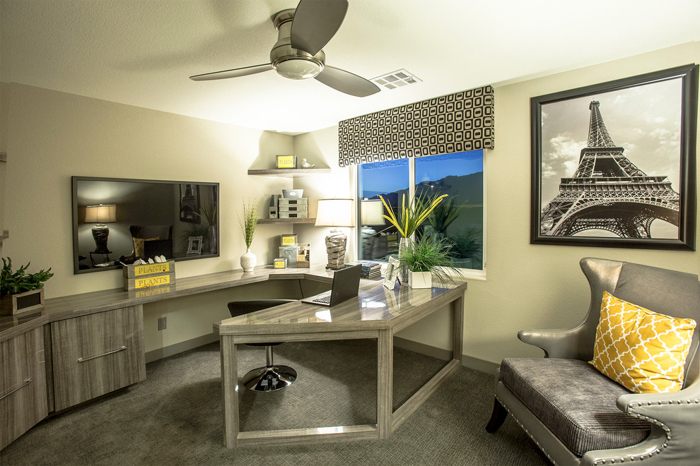 Mid-sized contemporary home office in Las Vegas with beige walls, carpet and a built-in desk.