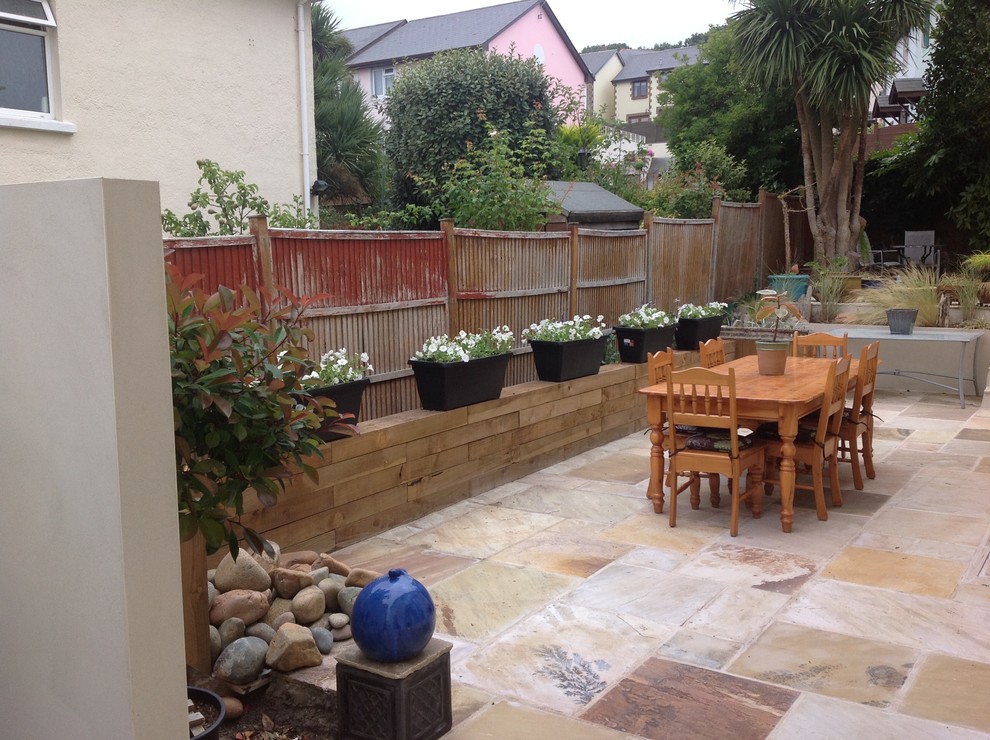 How do I cope with my horrible fence and planter?