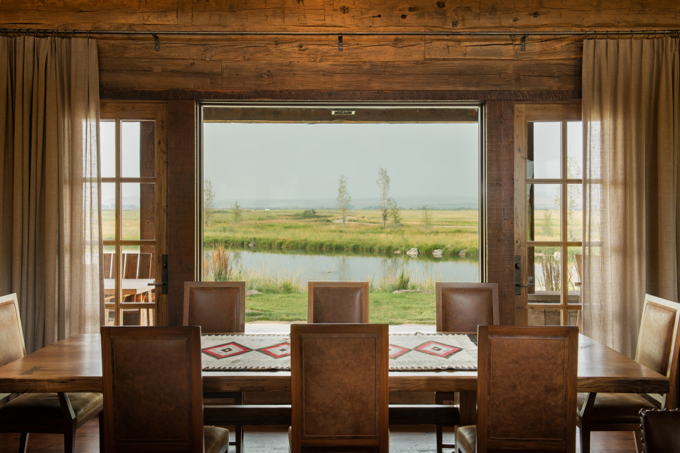 Great room - large transitional dark wood floor, exposed beam and wood wall great room idea