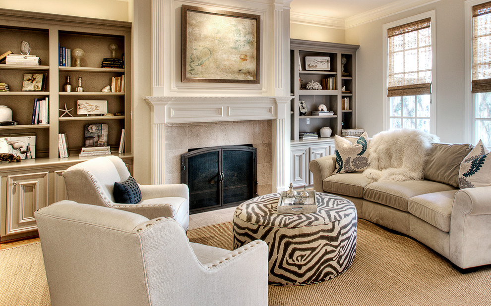 This is an example of a traditional living room in Houston with a stone fireplace surround.