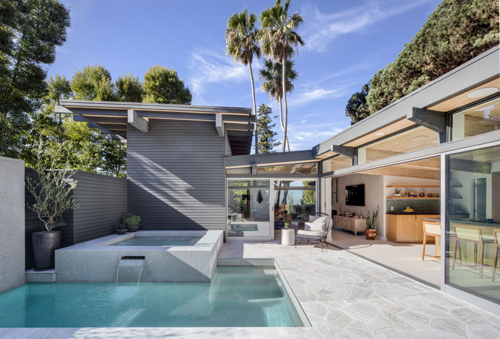 Inspiration for a 1960s pool remodel in Orange County