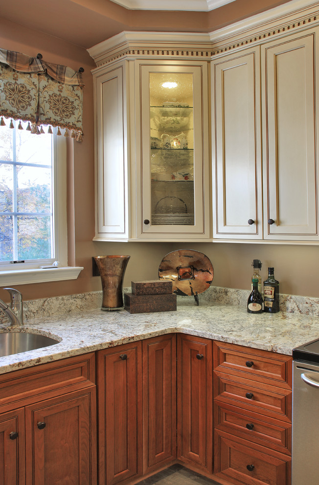 Inspiration for a mid-sized transitional u-shaped eat-in kitchen in Baltimore with a single-bowl sink, beaded inset cabinets, yellow cabinets, granite benchtops, stainless steel appliances, linoleum floors, a peninsula and beige floor.