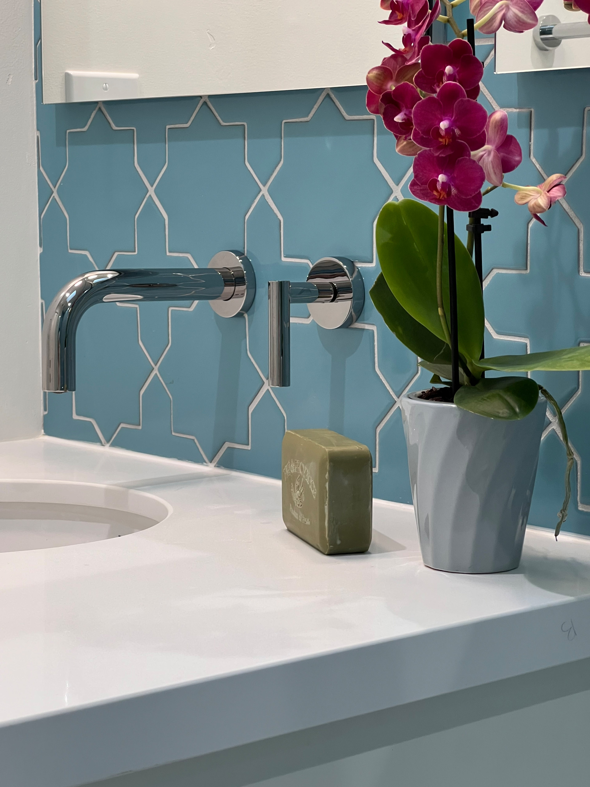 A Wall Mounted Faucet is Key to Maximizing Counter Space for a Compact Vanity
