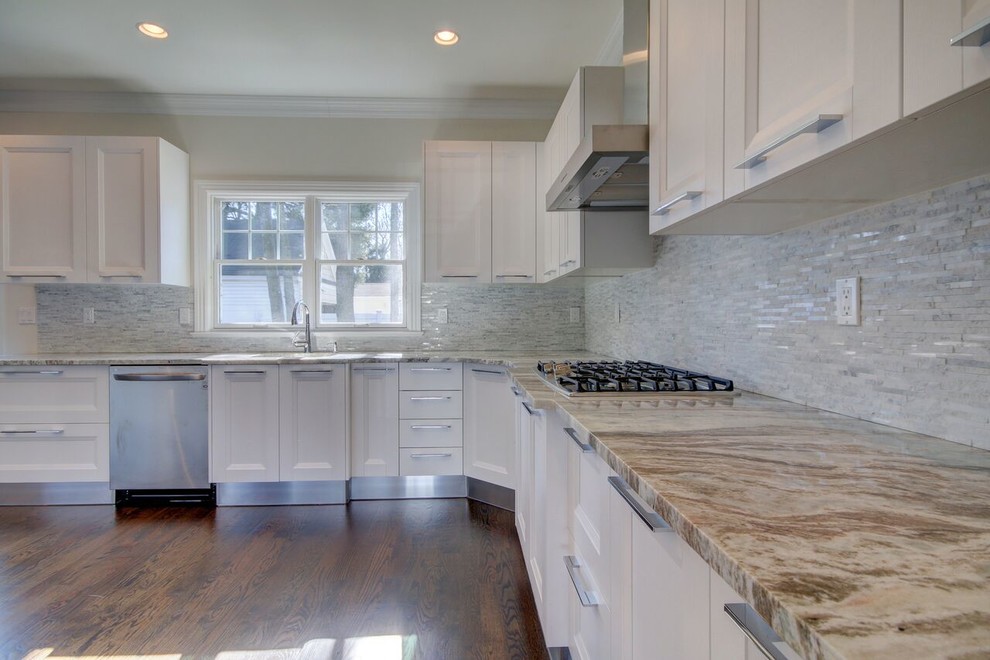 Kitchen - mid-sized transitional u-shaped brown floor kitchen idea in New York with shaker cabinets, white cabinets, quartz countertops, gray backsplash and gray countertops