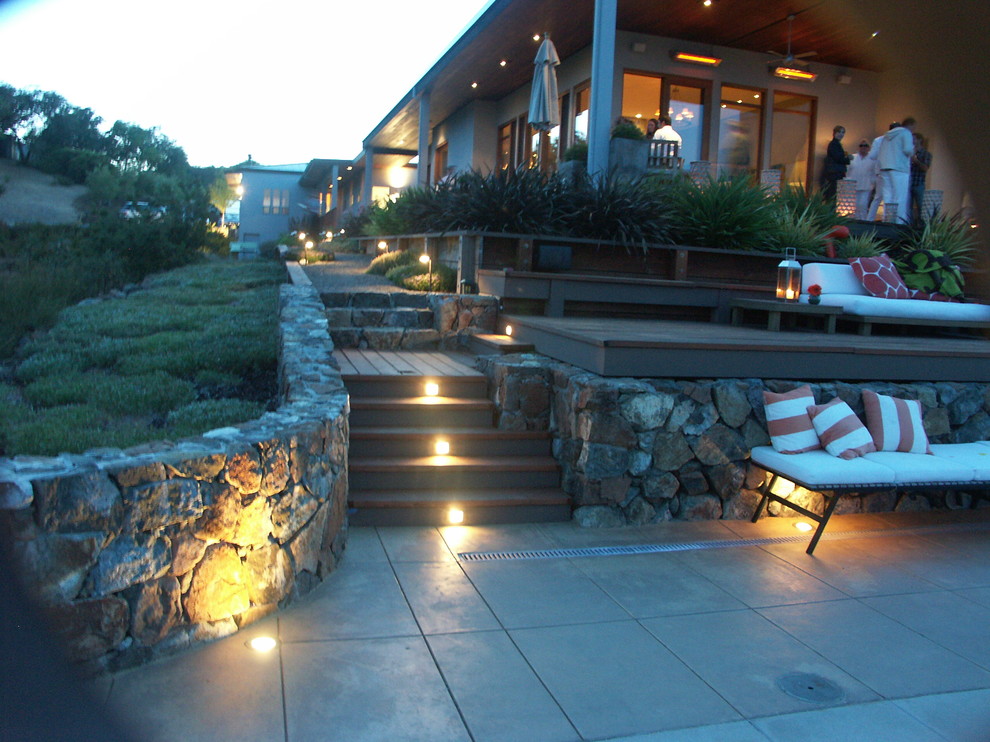 This is an example of an expansive contemporary backyard patio in San Francisco with decking.