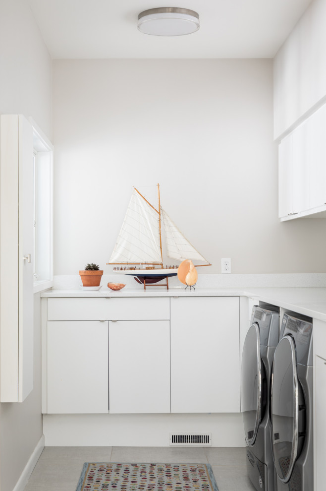 Inspiration for a beach style laundry room in Other.
