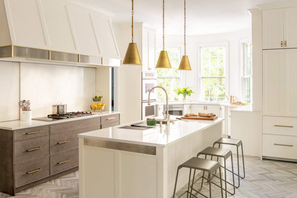 Design ideas for a beach style u-shaped kitchen in Portland Maine with white cabinets, white splashback, ceramic floors, with island, grey floor, stone slab splashback, stainless steel appliances and white benchtop.