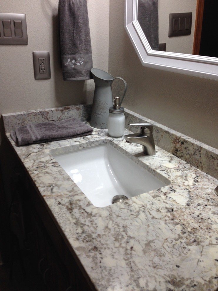 Bathroom - bathroom idea with an undermount sink and granite countertops