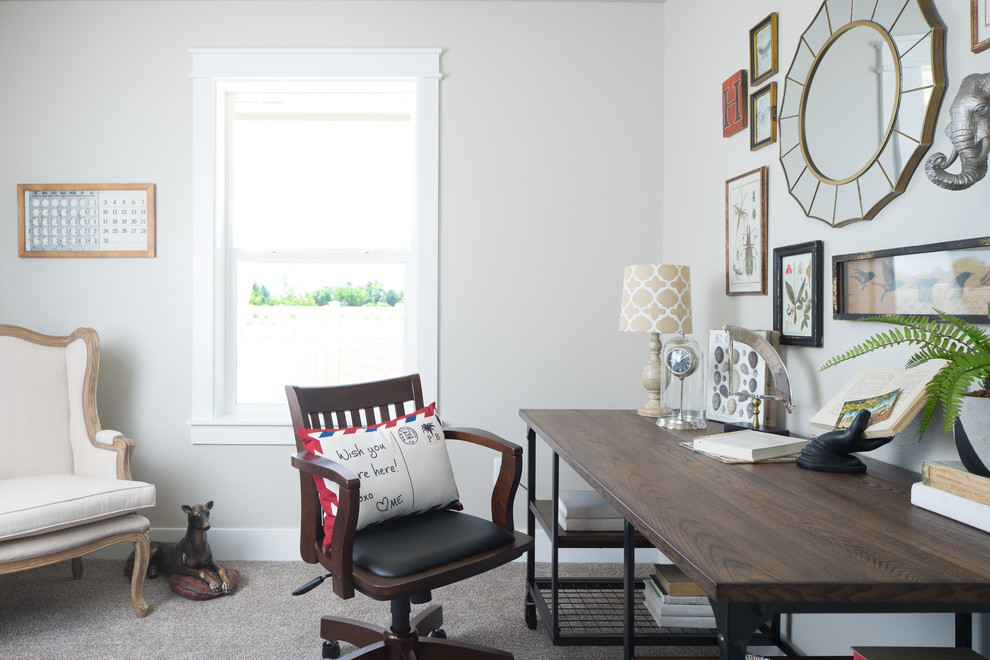 Inspiration for a transitional home office in Boise with grey walls, carpet, a freestanding desk and grey floor.