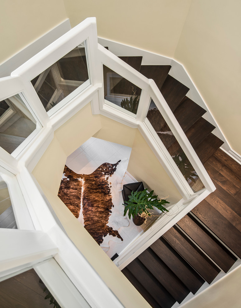 Inspiration for a transitional wood curved staircase in Miami with wood risers.