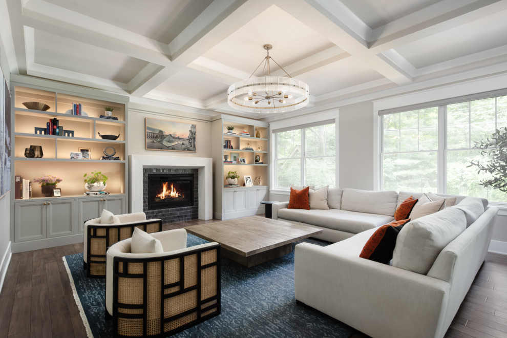 Example of a transitional dark wood floor, brown floor and coffered ceiling living room design in Philadelphia with gray walls, a standard fireplace and a tile fireplace