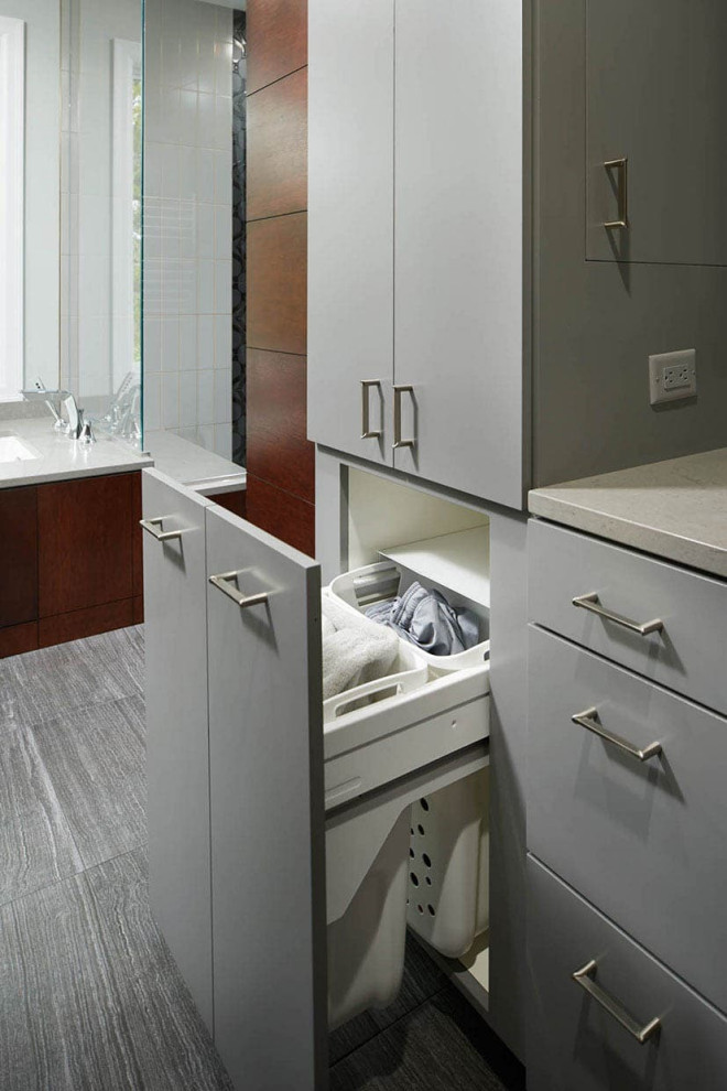 This is an example of a mid-sized contemporary galley utility room in Minneapolis with an undermount sink, flat-panel cabinets and white cabinets.
