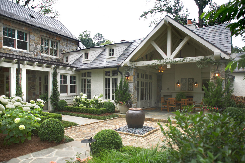 This is an example of a traditional exterior in Atlanta with mixed siding.