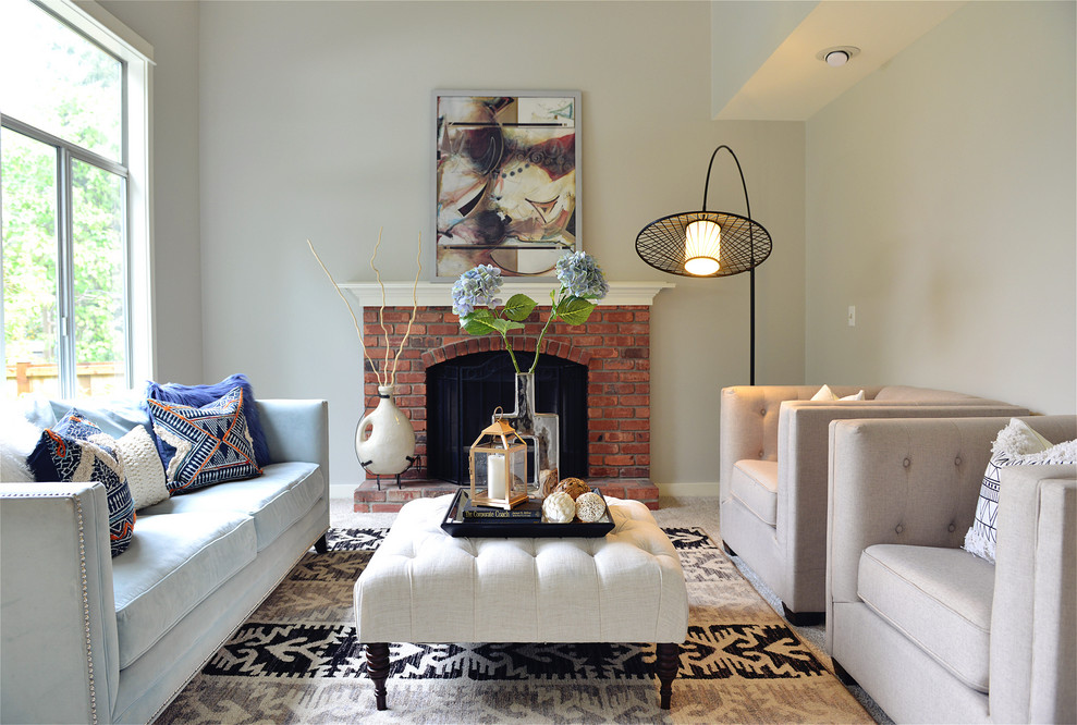 Inspiration for a transitional formal living room in Seattle with beige walls, carpet, a standard fireplace, a brick fireplace surround, no tv and beige floor.