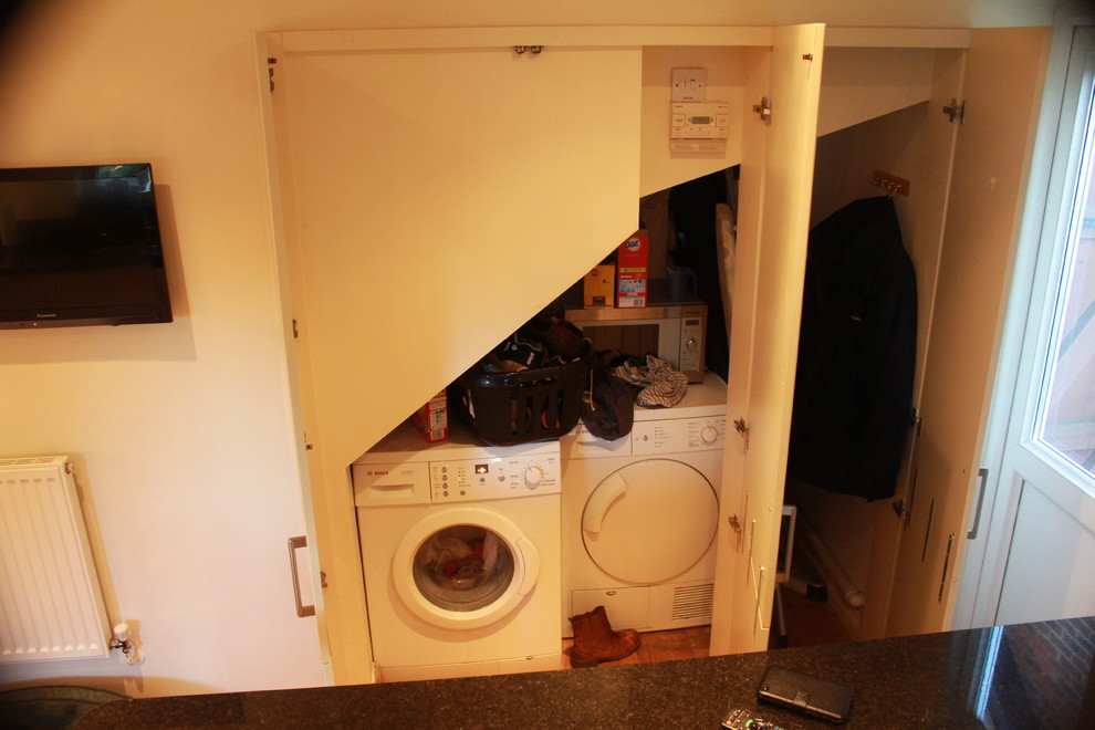 This is an example of a contemporary laundry room in Hertfordshire.
