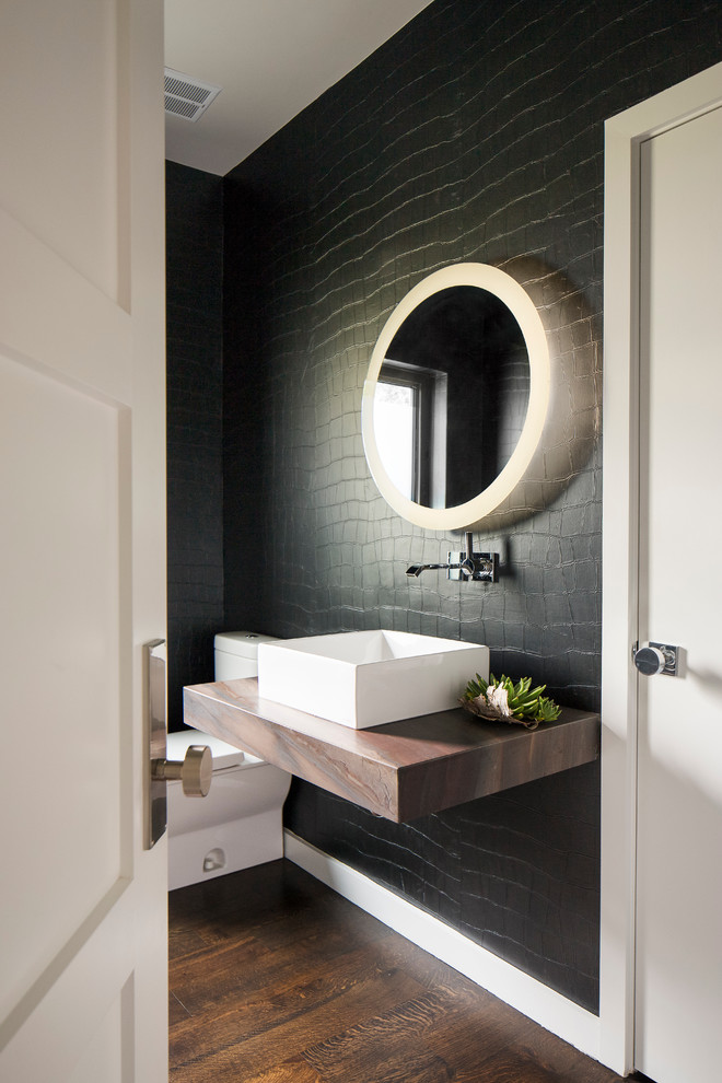 Design ideas for a contemporary powder room in Dallas with dark hardwood floors, wood benchtops, black walls, brown floor and brown benchtops.
