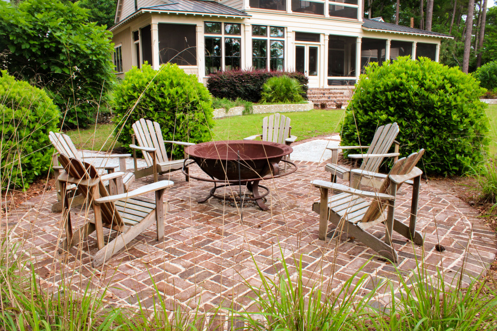 Inspiration for a coastal brick patio remodel in Atlanta with a fire pit and no cover