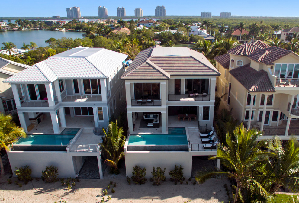 Example of a transitional home design design in Miami