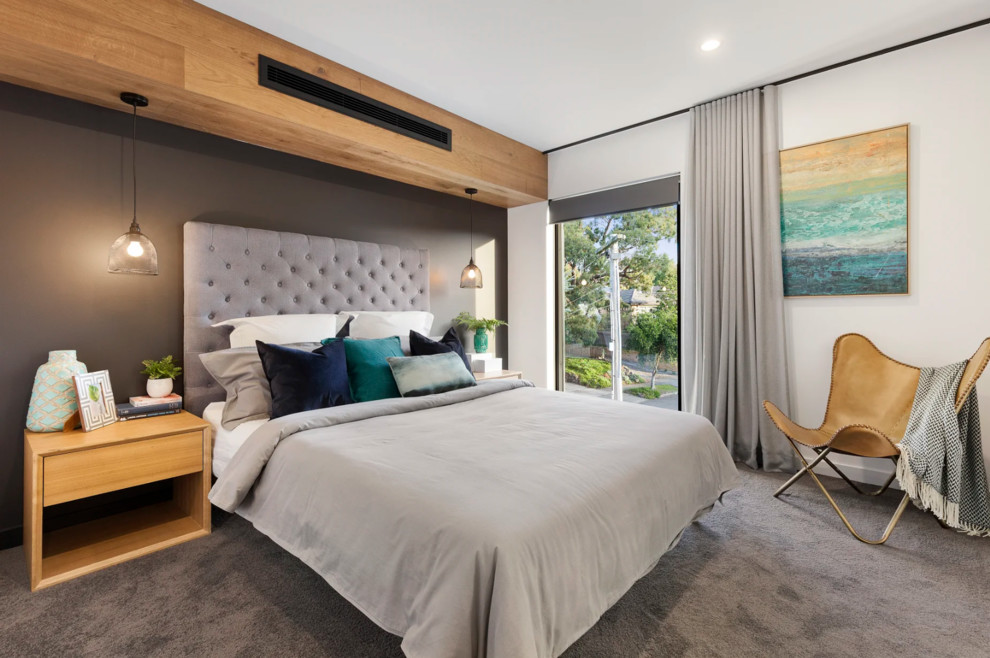 Photo of a contemporary master bedroom in Melbourne with white walls, carpet and grey floor.