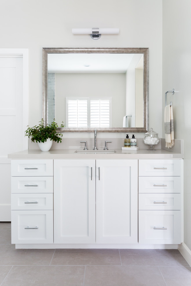 Inspiration for a large transitional master bathroom in Los Angeles with shaker cabinets, white cabinets, a drop-in tub, beige tile, ceramic tile, grey walls, porcelain floors, an undermount sink, engineered quartz benchtops and grey floor.