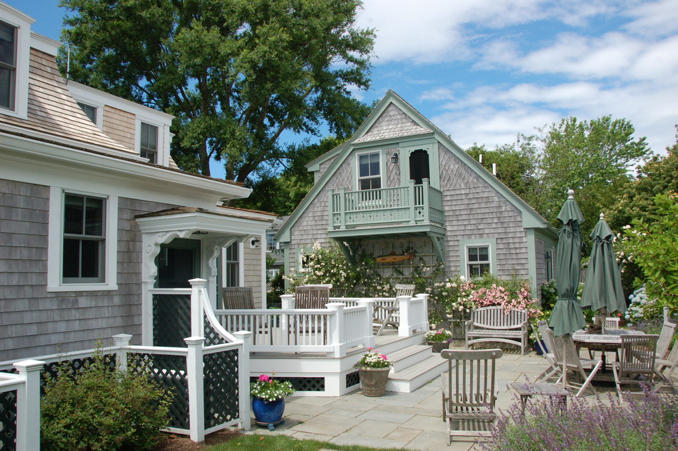 Inspiration for a beach style two-storey exterior in Boston with wood siding.