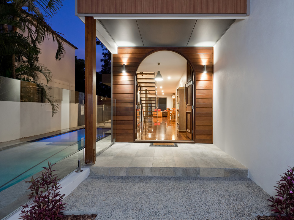 Design ideas for a contemporary front door in Brisbane with white walls, a single front door and a dark wood front door.