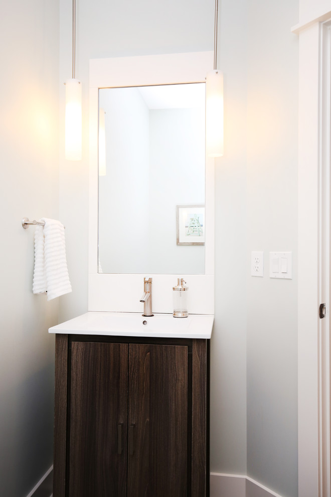 Photo of a beach style powder room in Grand Rapids.