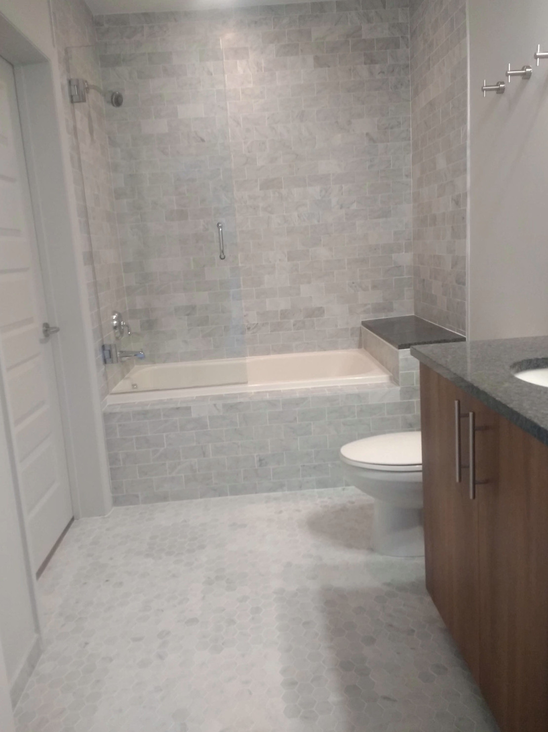 Midtown high-rise marble tile bathroom.