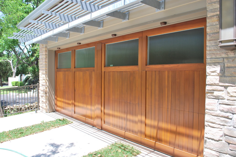 Photo of a large midcentury detached two-car garage in Austin.