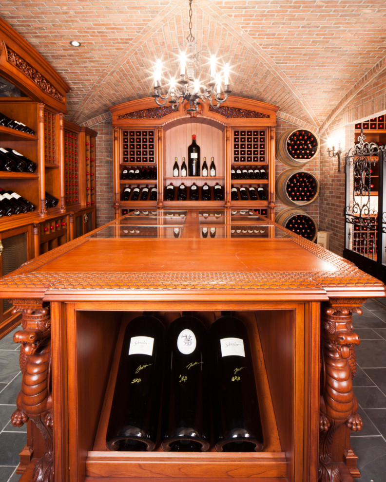 Expansive traditional wine cellar in New York with ceramic floors, display racks and grey floor.