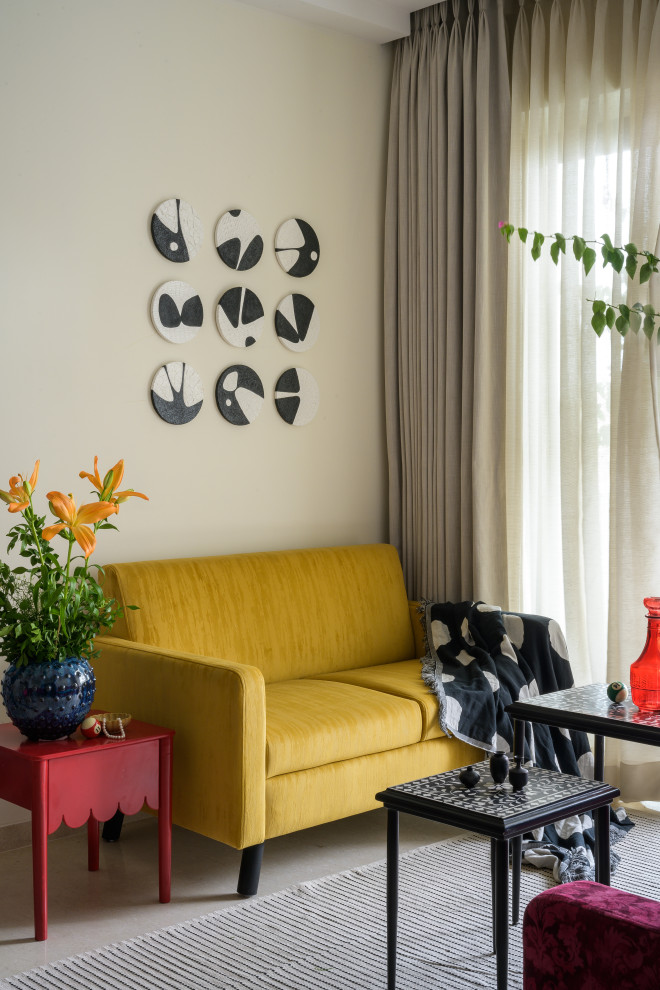 Inspiration for an eclectic living room in Mumbai With Beige Walls and Gray.