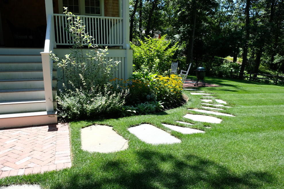 Mid-sized traditional backyard full sun xeriscape in Boston with a garden path and brick pavers for summer.