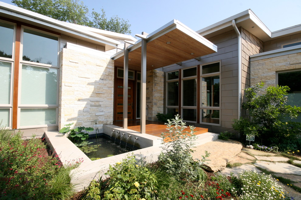 Design ideas for a contemporary verandah in Dallas with a water feature.