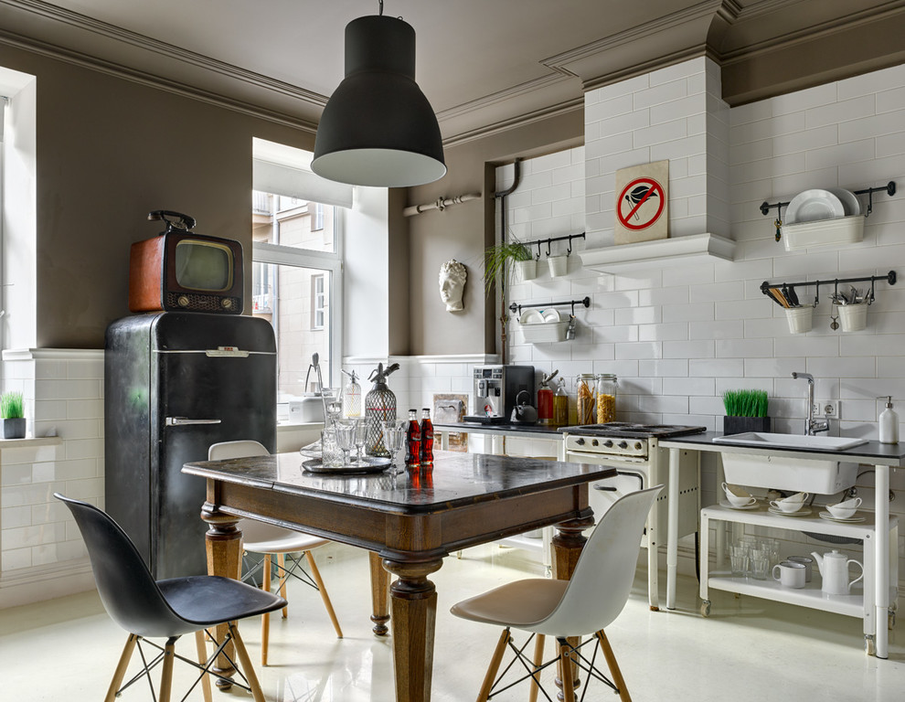 Eclectic kitchen in Moscow with a drop-in sink, open cabinets, white splashback, subway tile splashback, no island and black appliances.