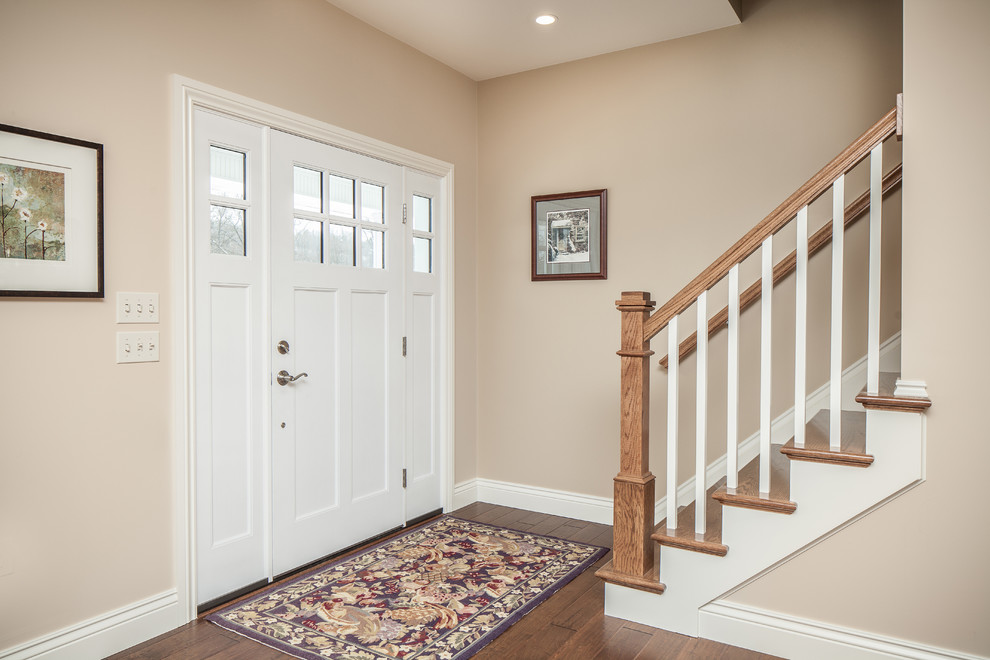 Mid-sized arts and crafts wooden straight staircase photo in Philadelphia with wooden risers