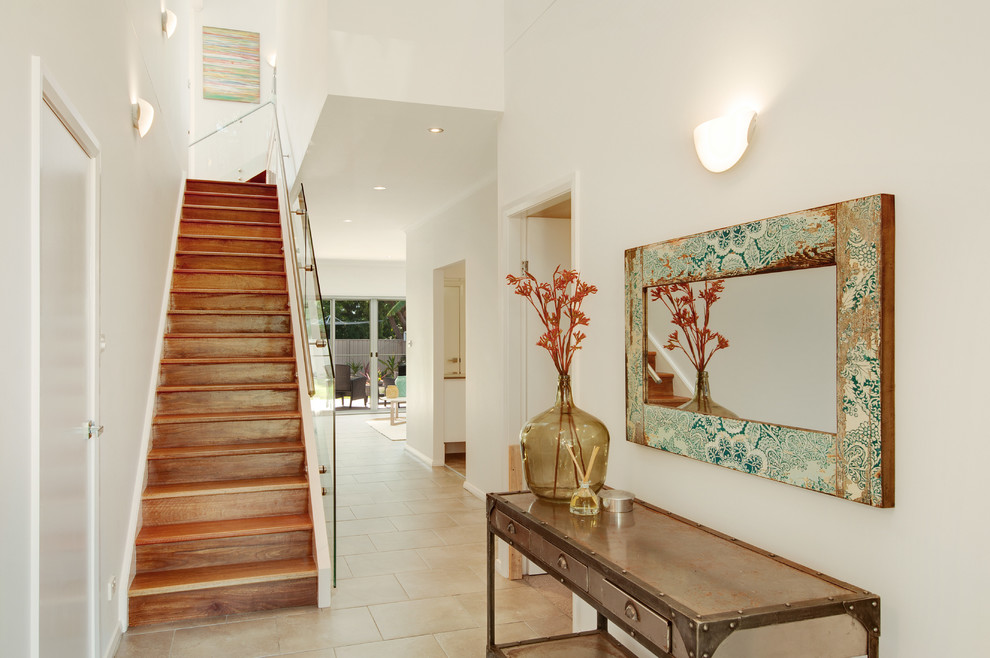 Beach style wood l-shaped staircase in Central Coast with wood risers and metal railing.