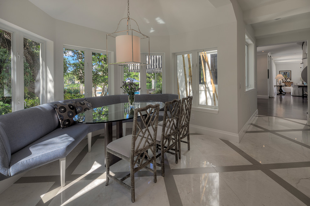 Design ideas for a transitional dining room in Miami with grey walls.