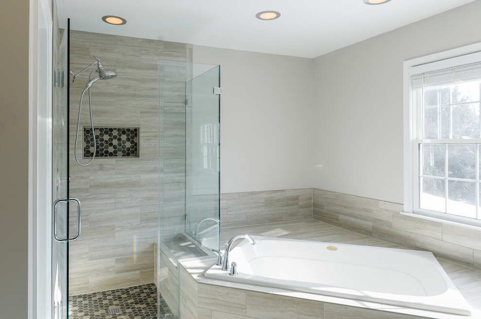 Inspiration for a large transitional master bathroom in DC Metro with raised-panel cabinets, white cabinets, a corner tub, a corner shower, a two-piece toilet, multi-coloured tile, porcelain tile, white walls, porcelain floors, multi-coloured floor and a hinged shower door.