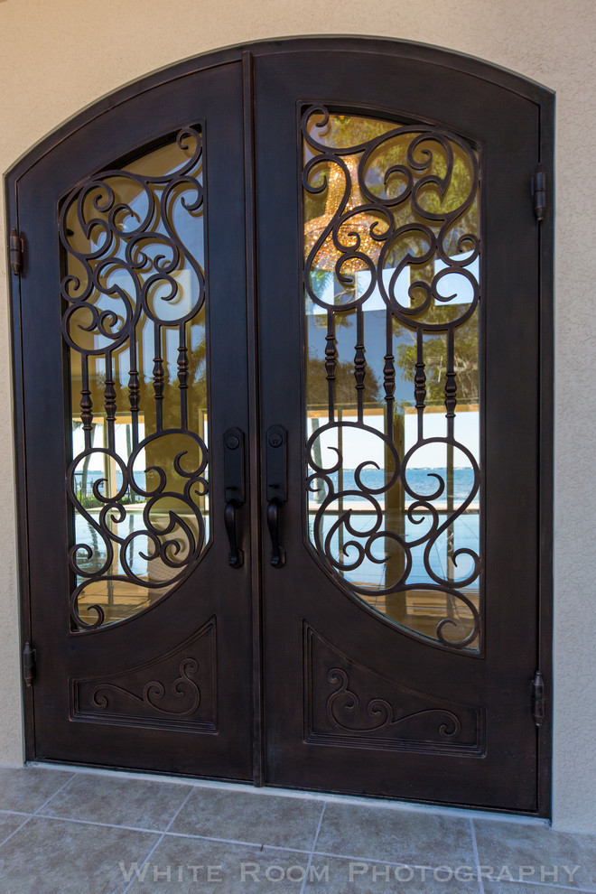 Inspiration for a huge transitional front door remodel with beige walls and a dark wood front door