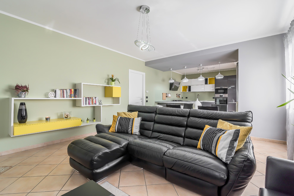 Large contemporary open concept living room in Rome with multi-coloured walls and ceramic floors.