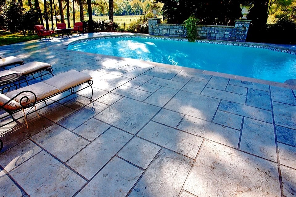 Design ideas for a mid-sized mediterranean courtyard custom-shaped aboveground pool in Other with decking.